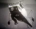 Bell model 30 Helicopter in flight picking up man